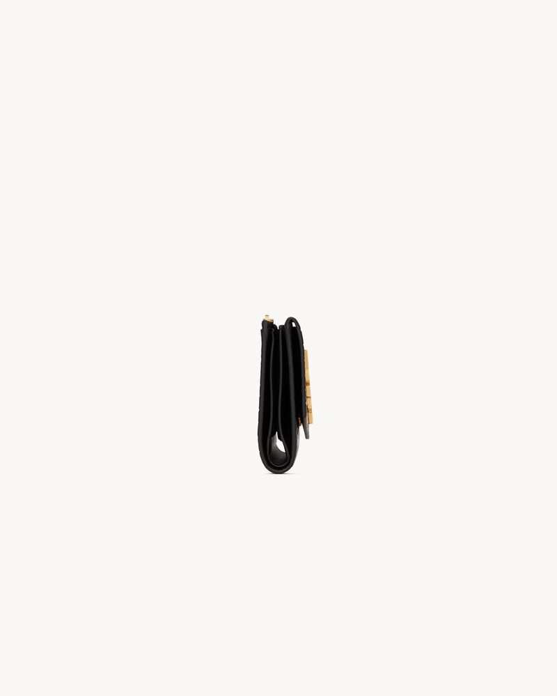 Cartera compacta Uptown de piel repujada de cocodrilo brillante