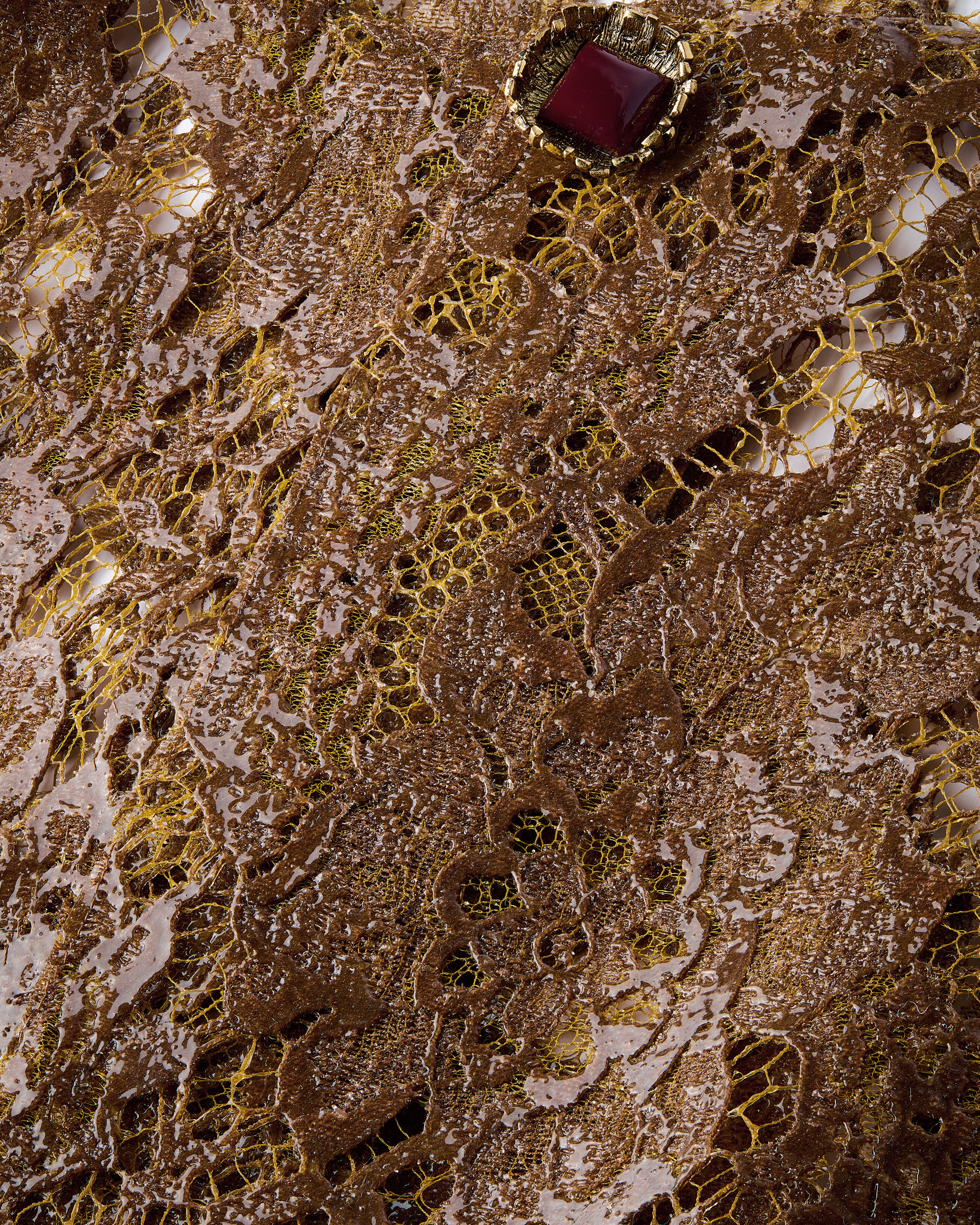 short jacket in silicone-coated lace