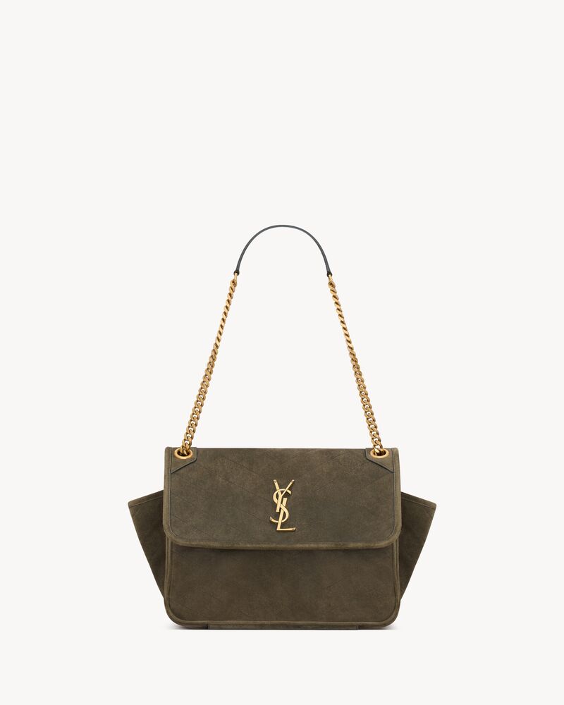 NIKI TRIPOUCH en suède