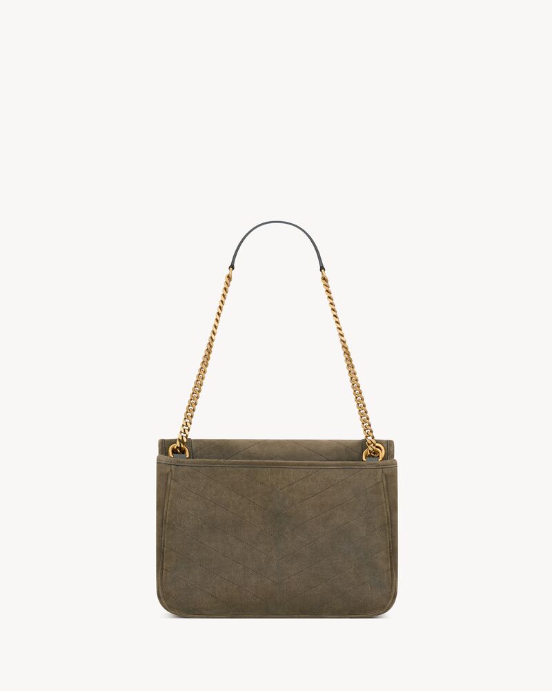 NIKI TRIPOUCH en suède