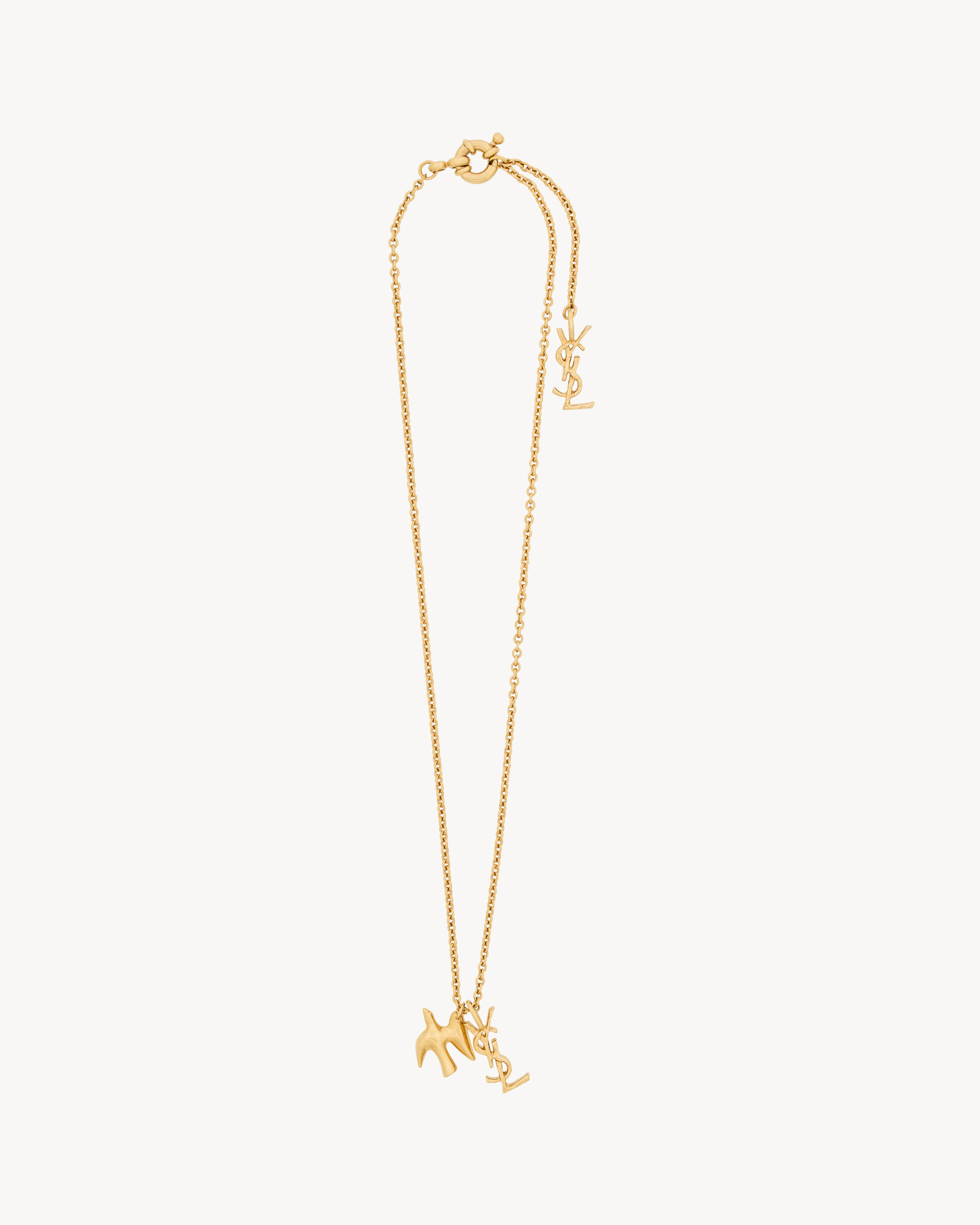 YSL   Women's Patinated Gold Cassandre Dove Necklace In Brass - Yellow/Gold 