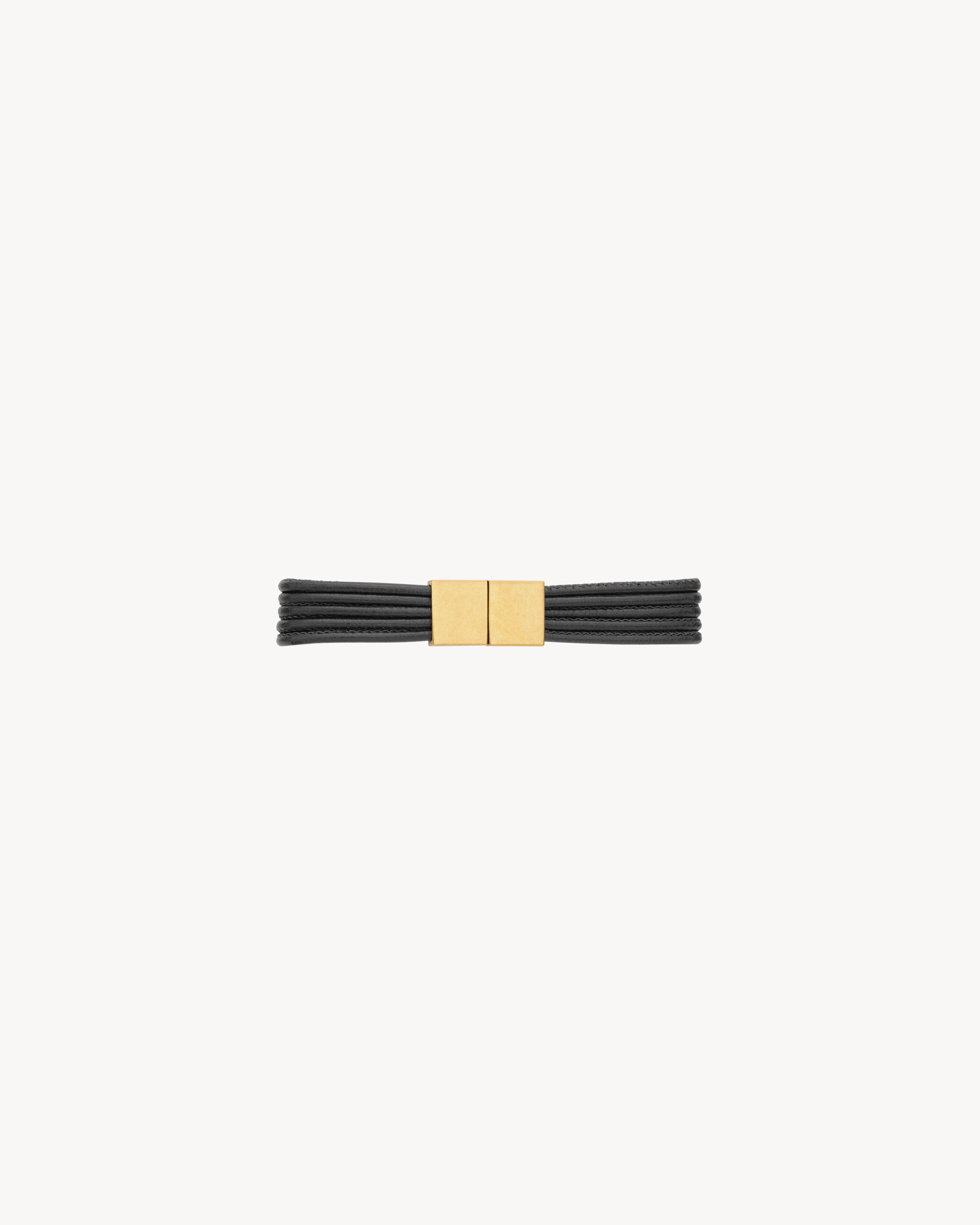 CASSANDRE cord bracelet in leather and metal