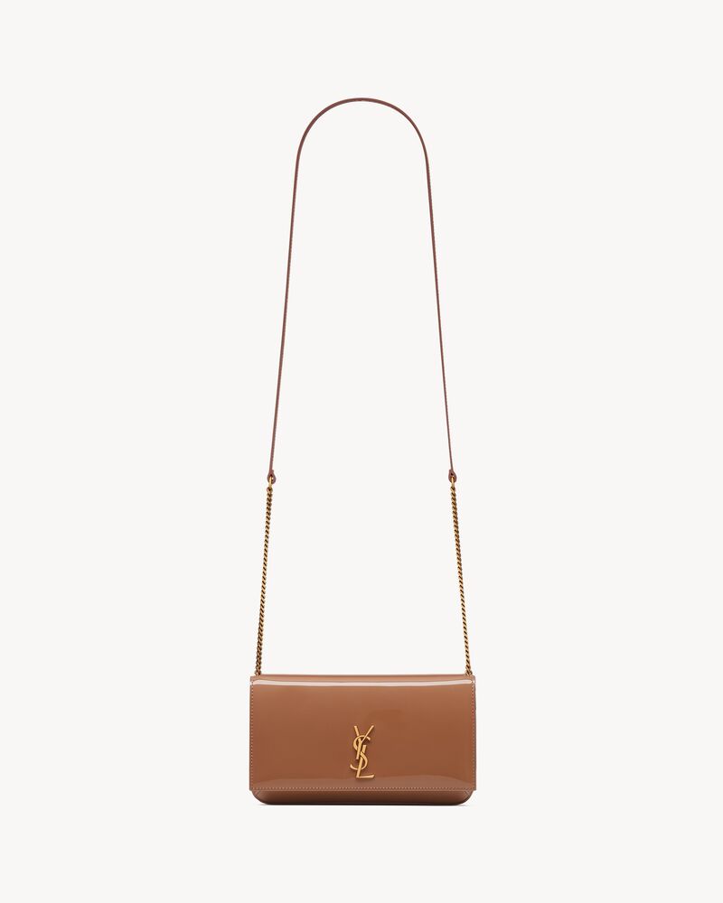 CASSANDRE phone holder in patent leather