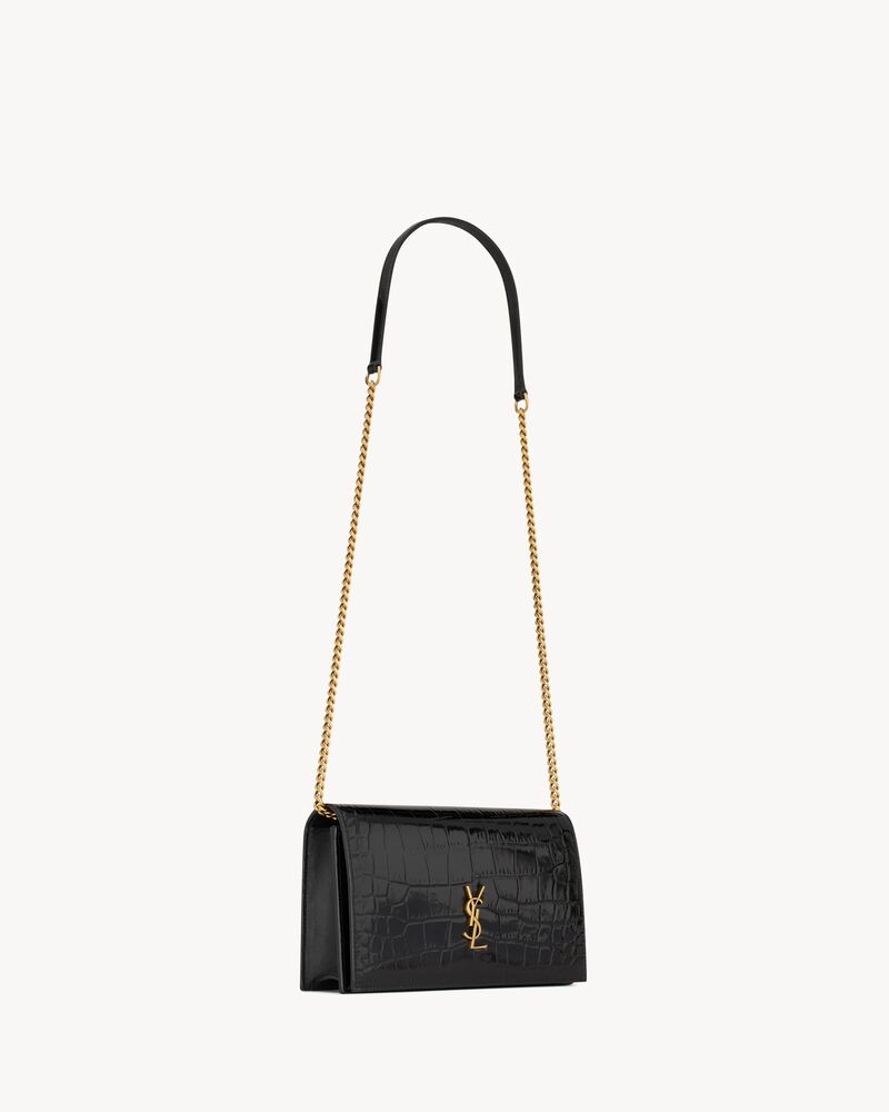 CASSANDRE envelope chain wallet in crocodile-embossed patent leather