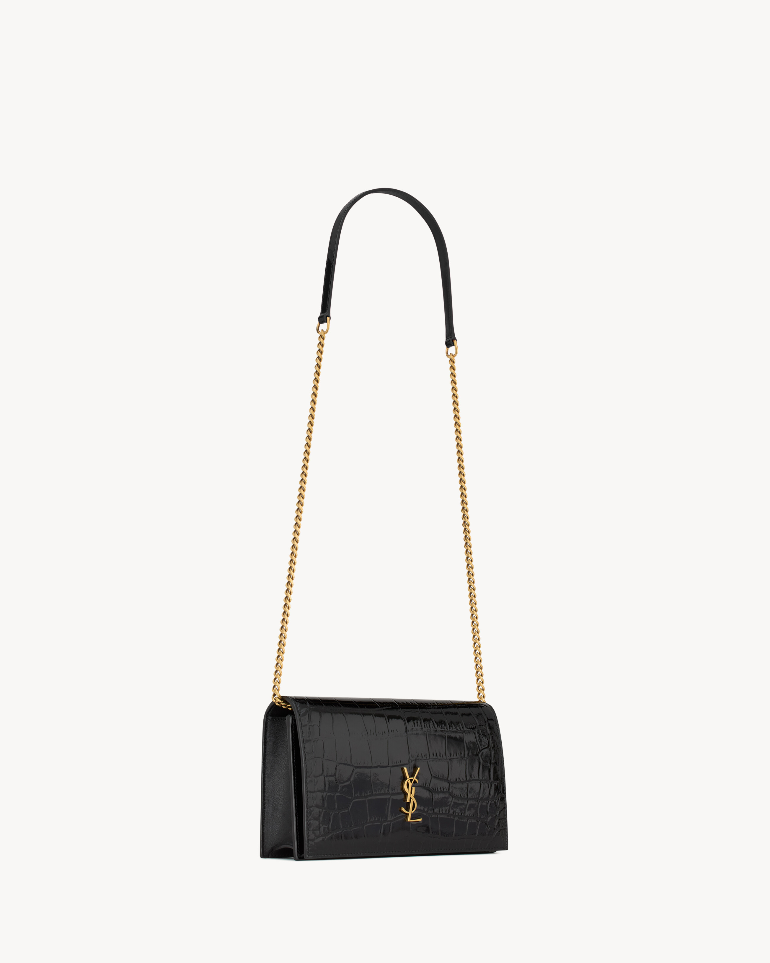 CASSANDRE envelope chain wallet in crocodile-embossed patent leather