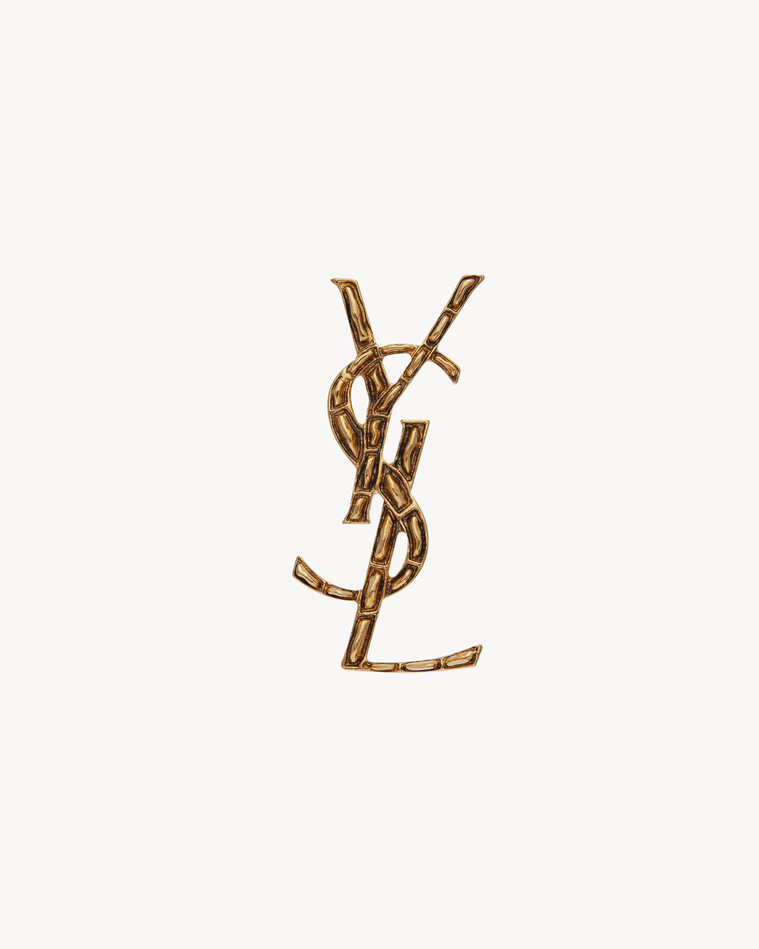 CASSANDRE crocodile brooch in metal