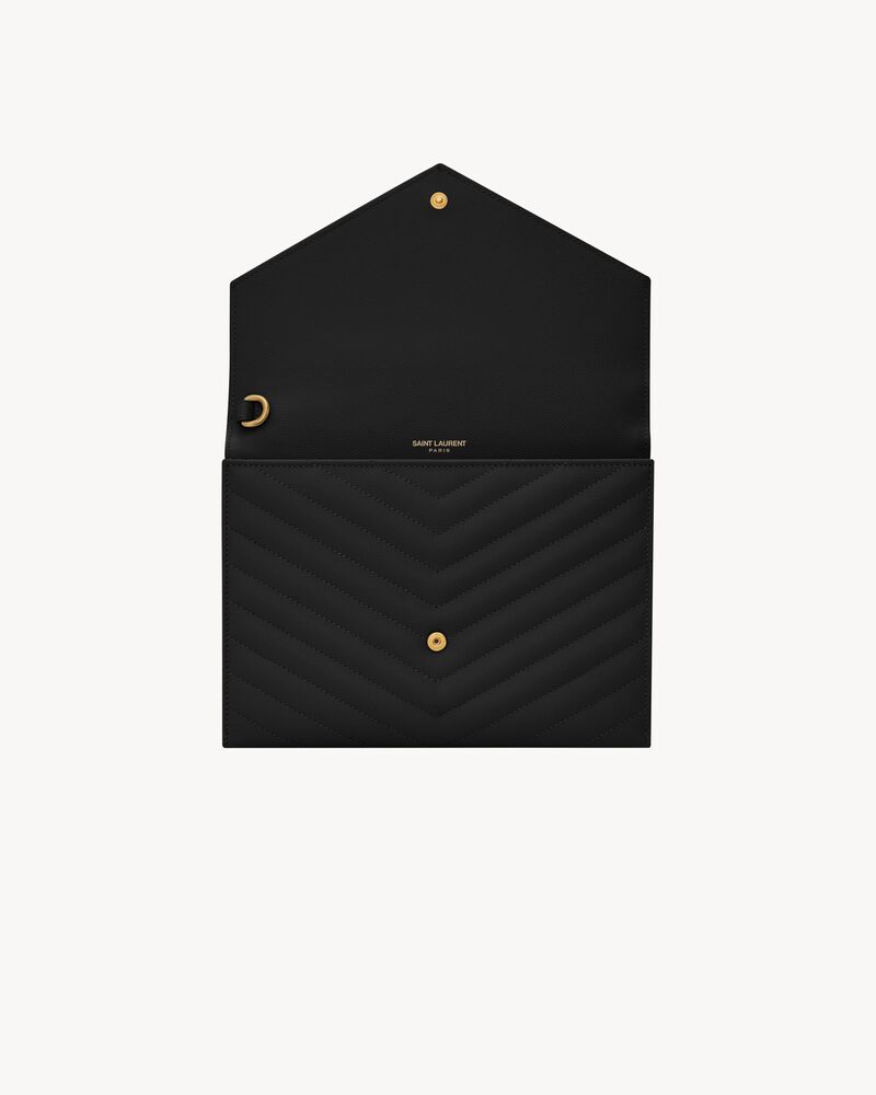 CASSANDRE Cartera de mano de piel acolchada y repujada grain de poudre