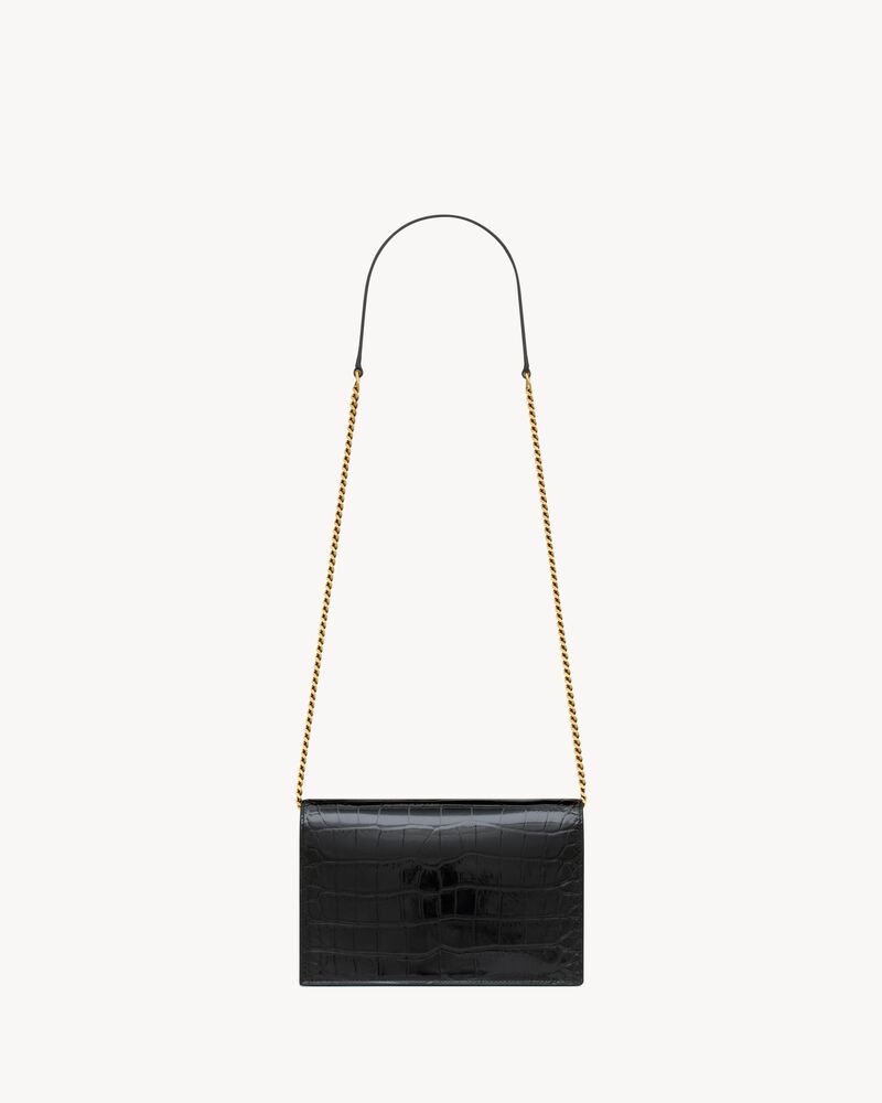 CASSANDRE envelope chain wallet in crocodile-embossed patent leather