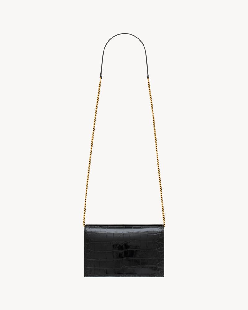 CASSANDRE envelope chain wallet in crocodile-embossed patent leather