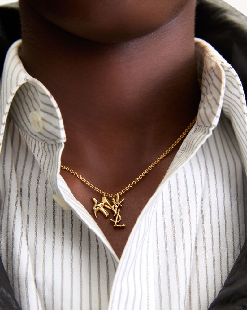 Collar de paloma y Cassandre de latón