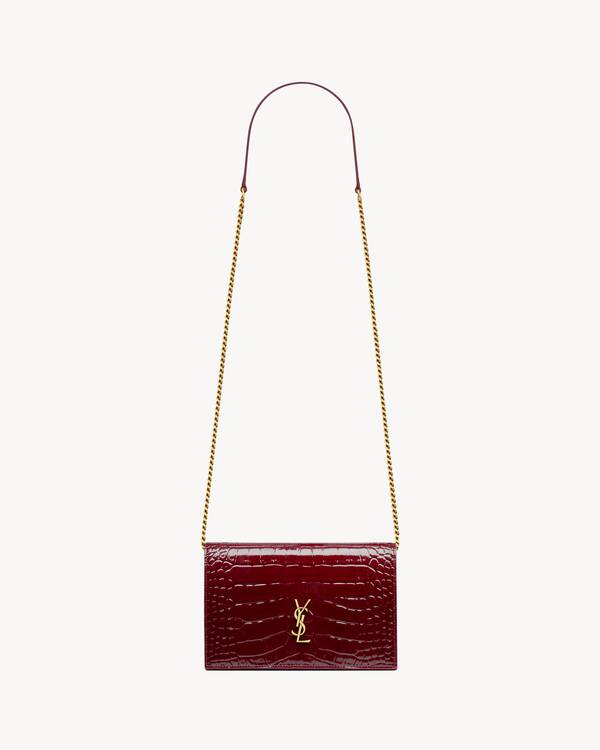 CASSANDRE envelope chain wallet in crocodile-embossed patent leather