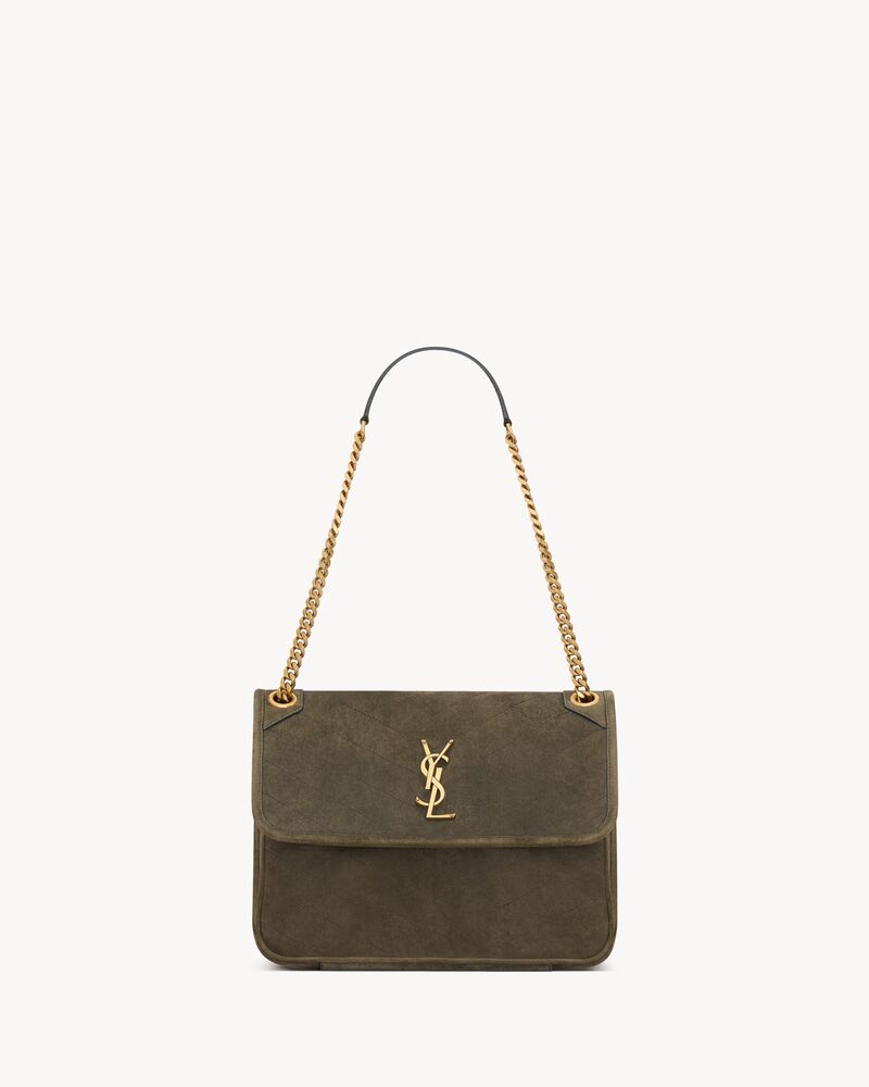 NIKI TRIPOUCH en suède