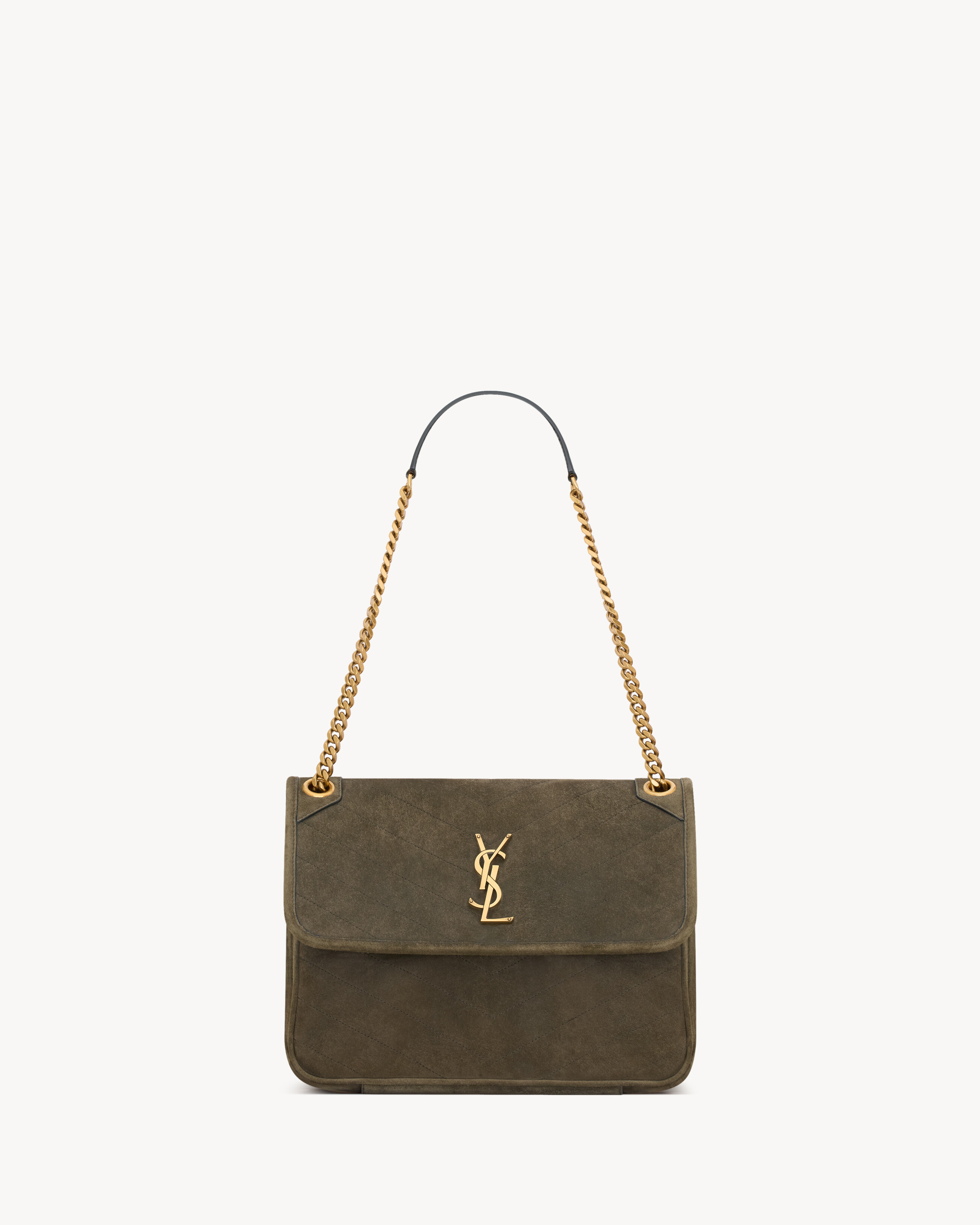 NIKI TRIPOUCH en suède