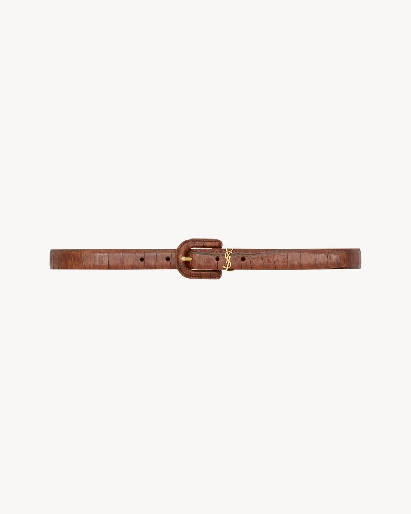 CASSANDRE covered U buckle thin belt in crocodile-embossed leather
