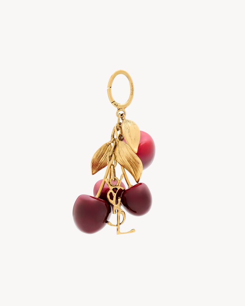 CASSANDRE cherry bag charm in resin and metal