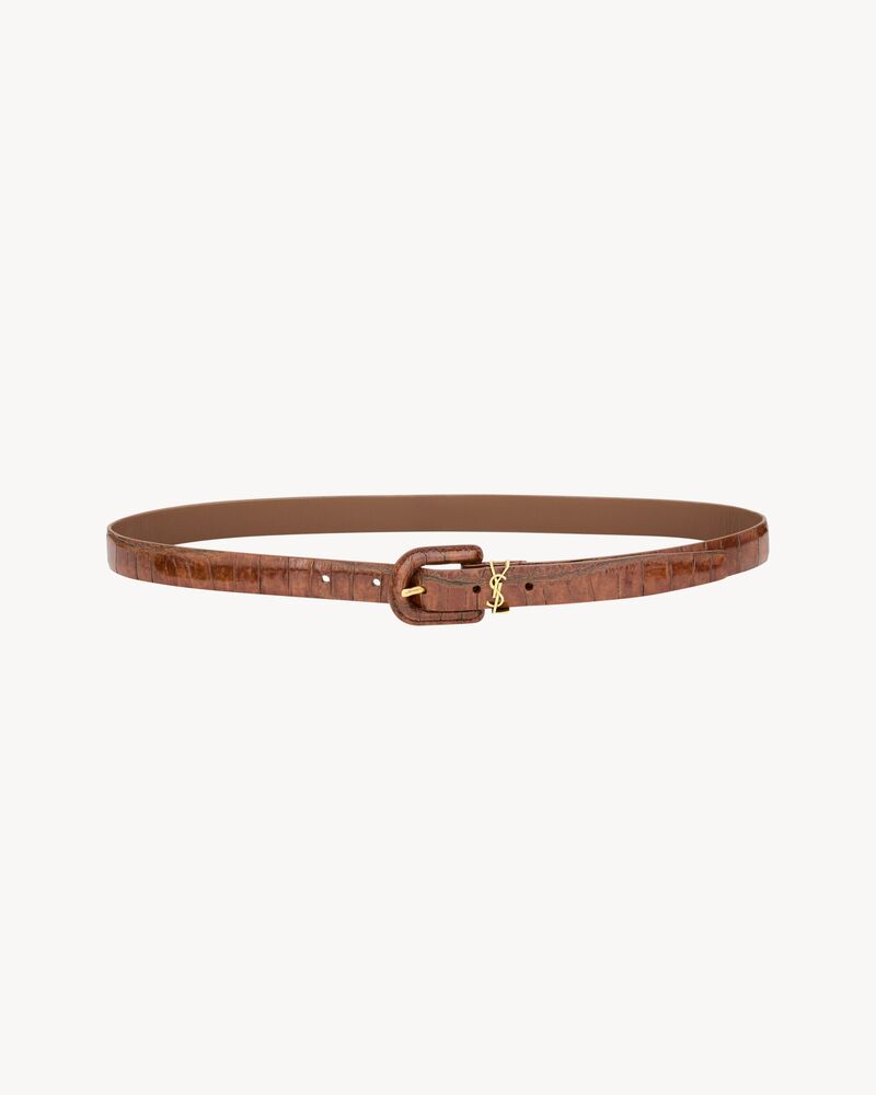 CASSANDRE covered U buckle thin belt in crocodile-embossed leather