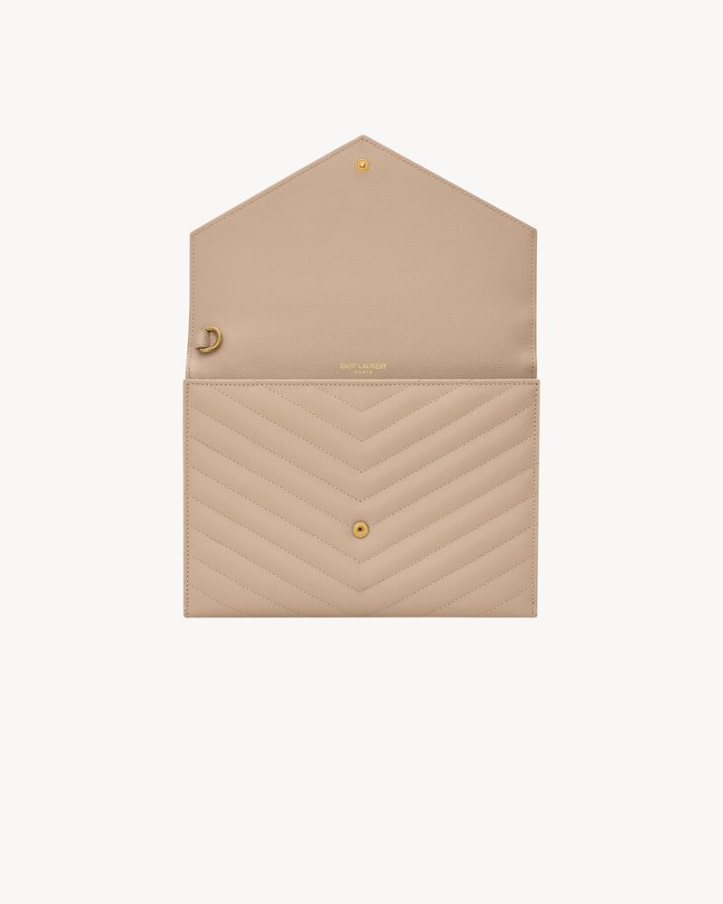 CASSANDRE Cartera de mano de piel acolchada y repujada grain de poudre