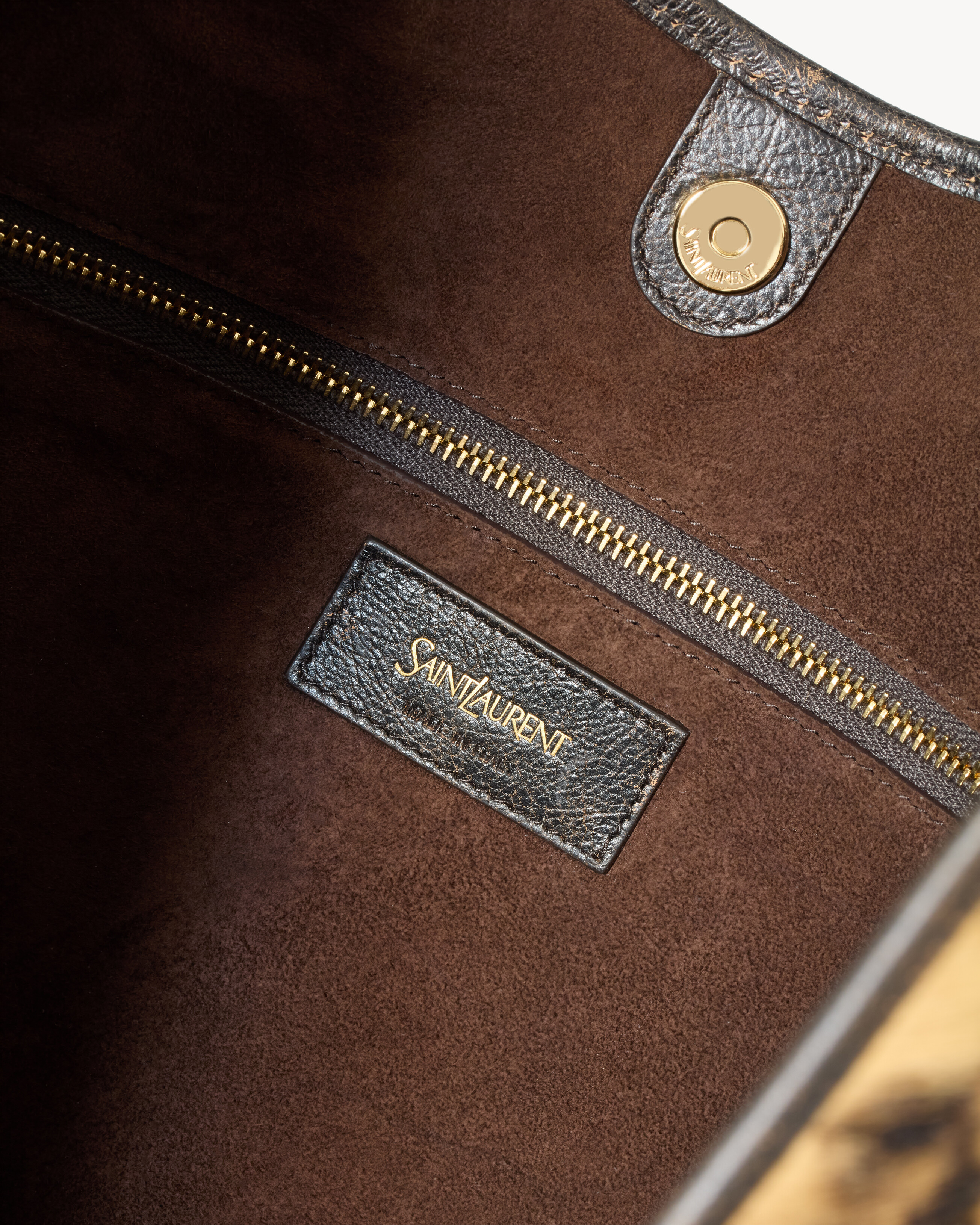 bolsa média MOMBASA em couro com pelo