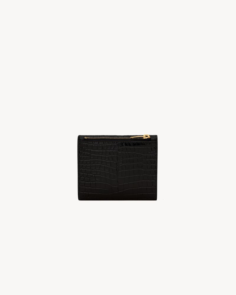 Cartera compacta Uptown de piel repujada de cocodrilo brillante