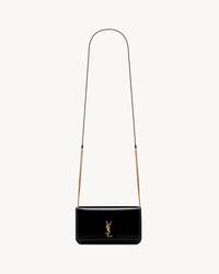 CASSANDRE phone holder IN PATENT LEATHER