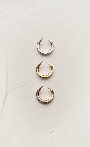 claw rings in 18k grey, yellow, and pale gold