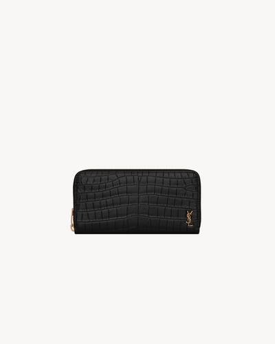 tiny cassandre zip-around wallet in crocodile-embossed matte leather