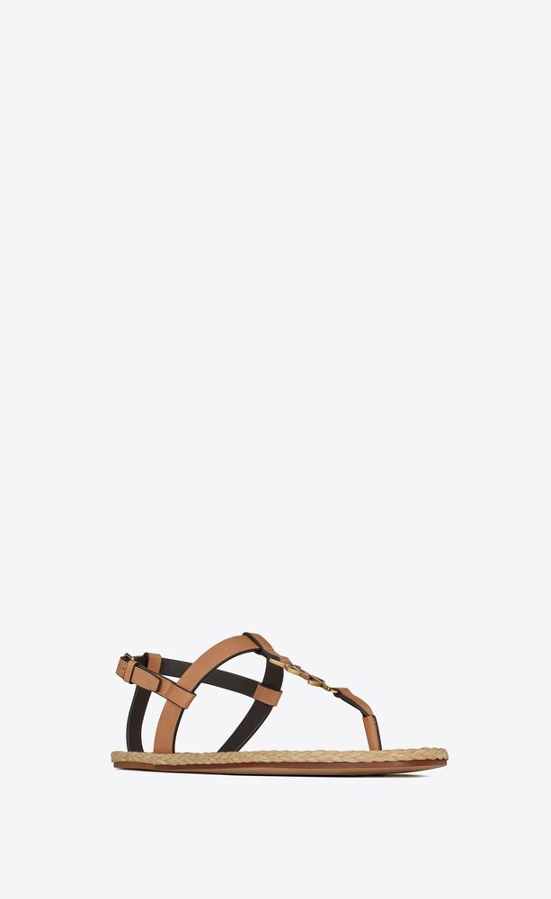 Cassandra flat sandals in vegetable-tanned leather with bronze-tone monogram | Saint Laurent | YSL.com