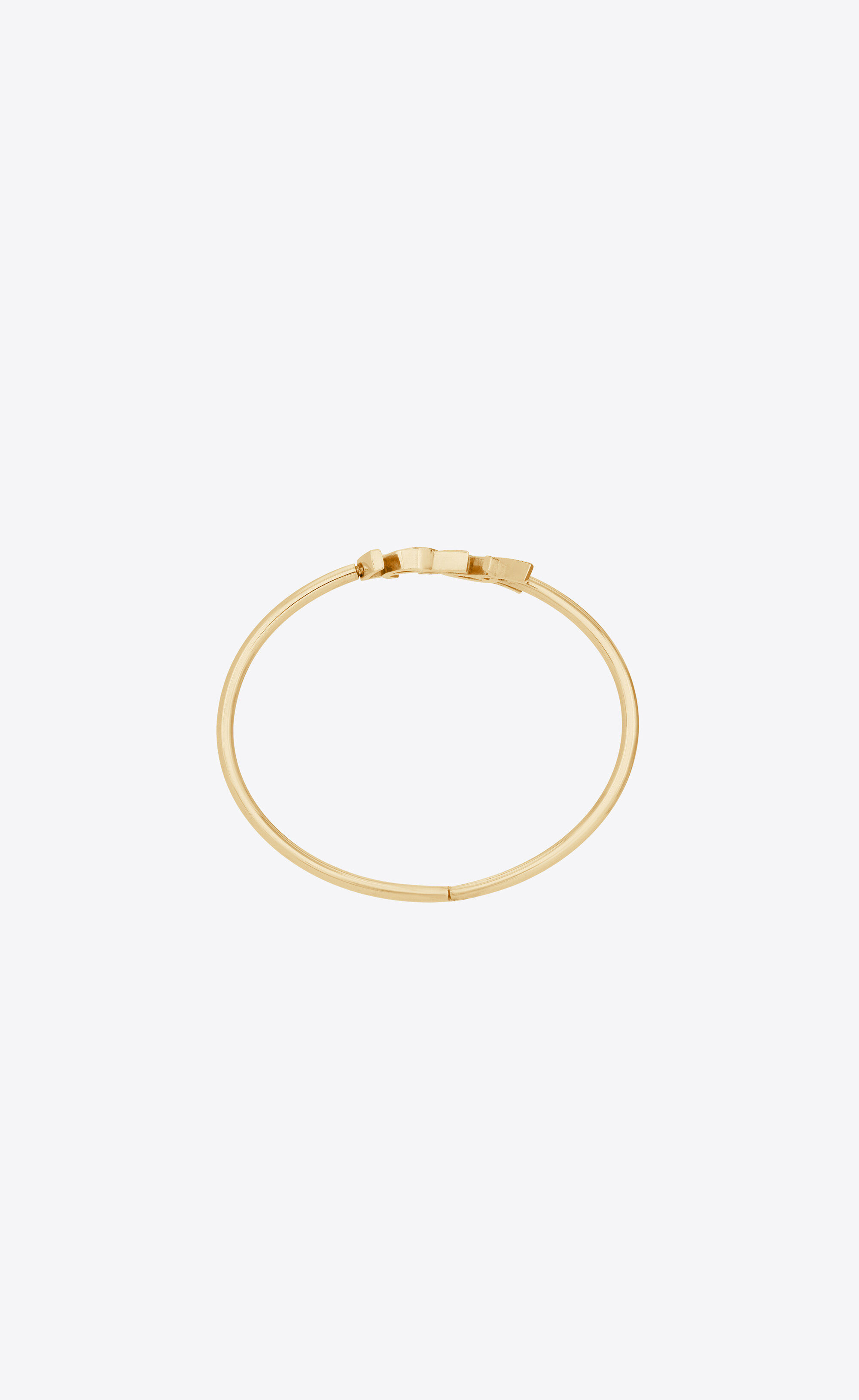 CASSANDRE hinged bangle in 18K yellow gold