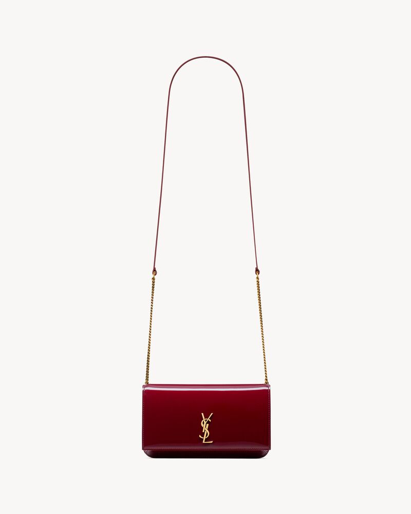 CASSANDRE phone holder in patent leather