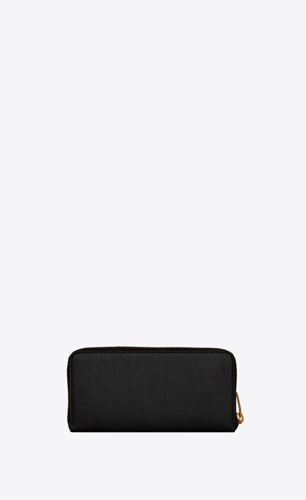 Womens Accessories Wallets and cardholders Saint Laurent Tiny Cassandre Zip-around Wallet In Grained Leather in Black 