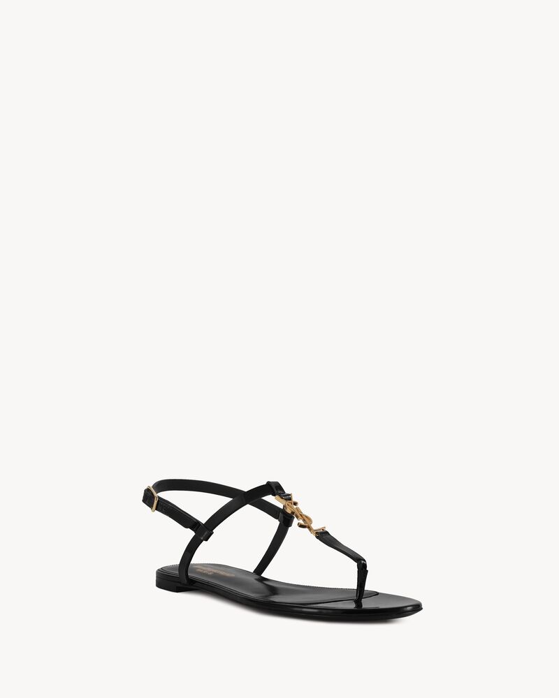 Cassandra flat sandals in patent leather with gold-tone monogram | Saint Laurent | YSL.com