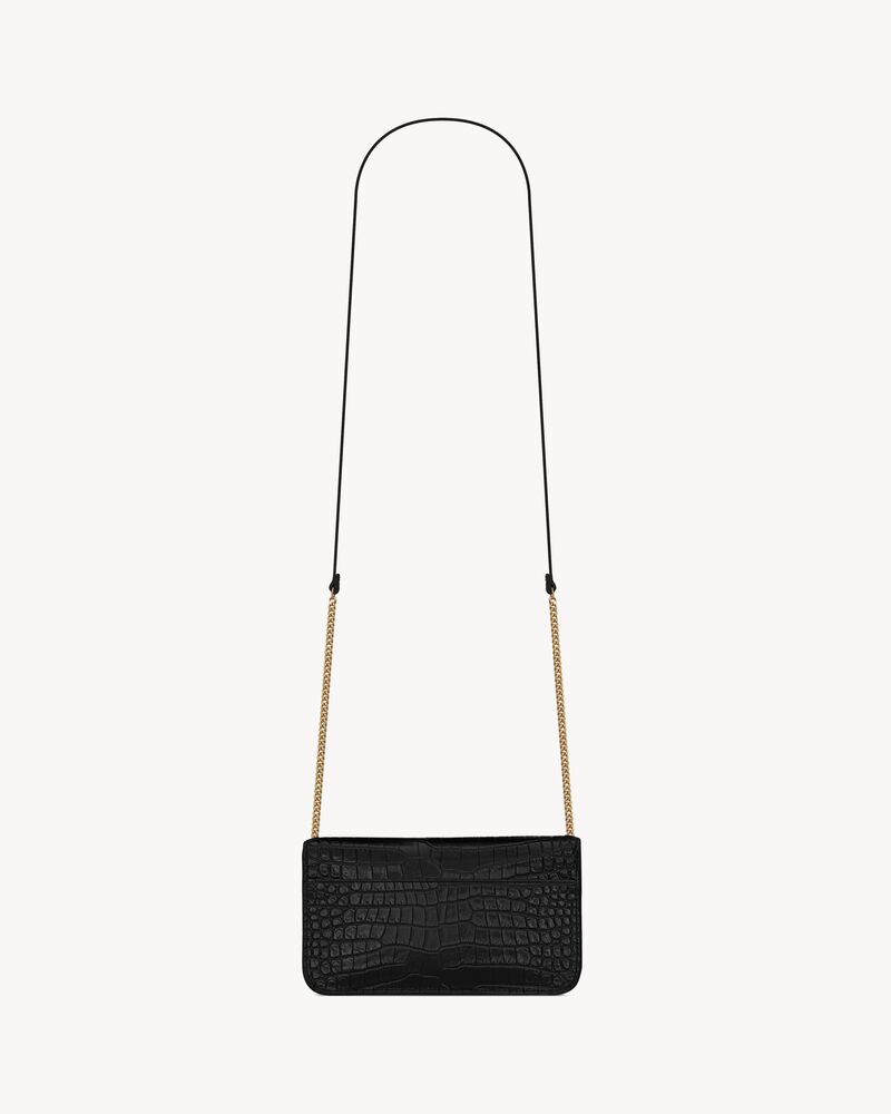 CASSANDRE phone holder in SHINY crocodile-embossed leather