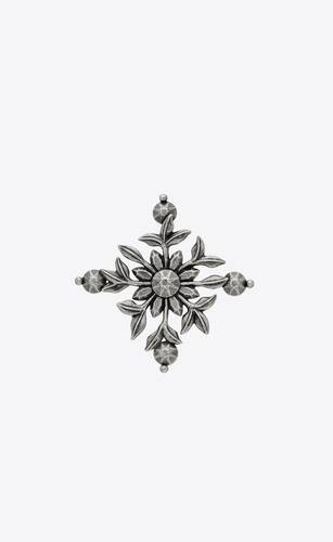 broche con cruz en forma de flor de metal