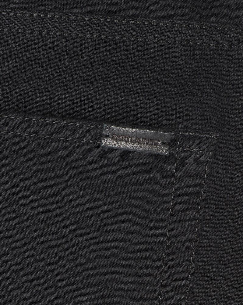 skinny-fit jeans in worn black denim | Saint Laurent | YSL.com
