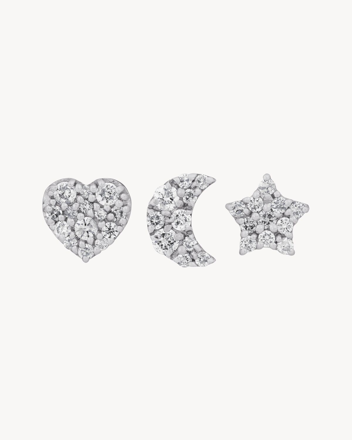 Charm brooches in 18K grey gold and diamonds