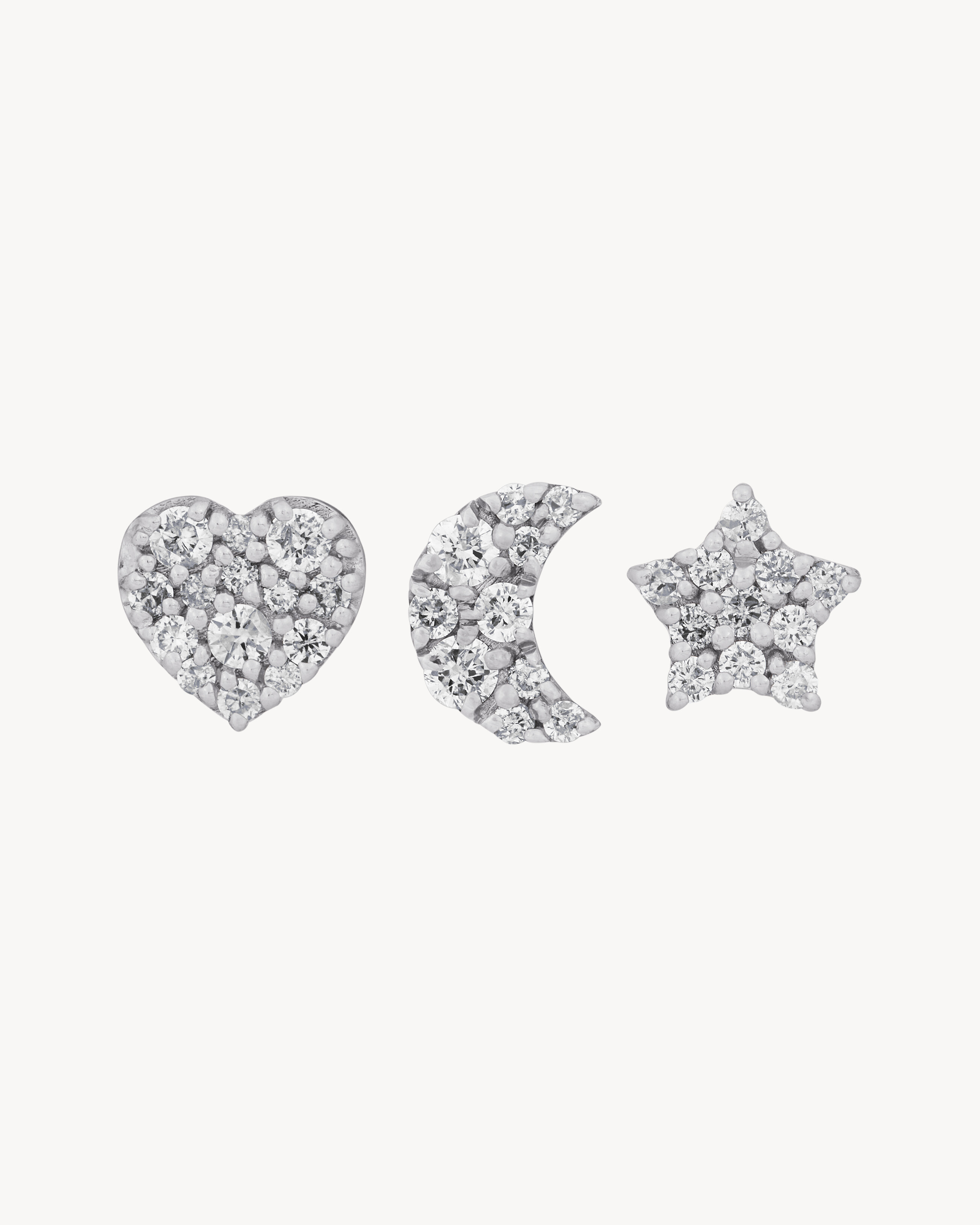 Charm brooches in 18K grey gold and diamonds