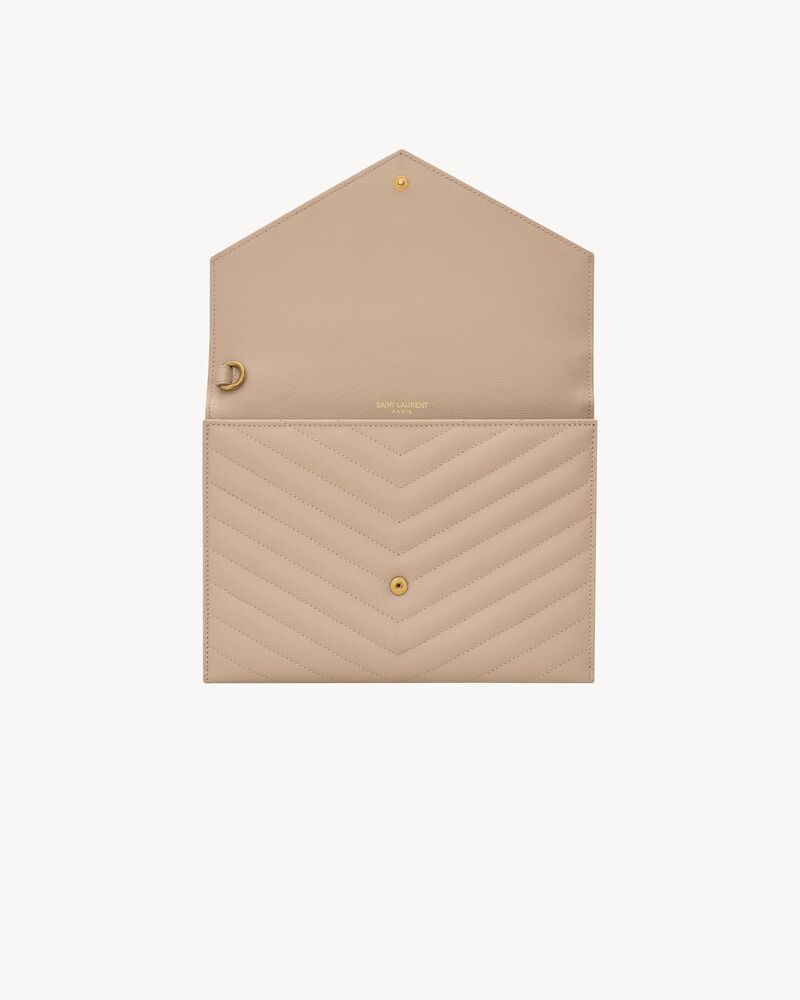 CASSANDRE MATELASSÉ FLAP POUCH in grain de poudre leather