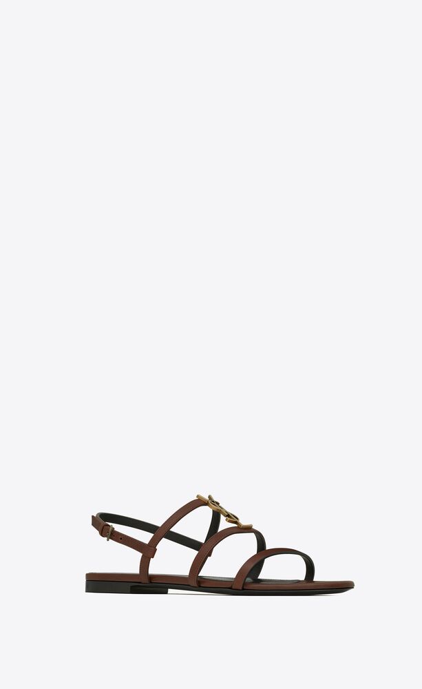 Cassandra flat sandals in smooth leather with gold-tone monogram | Saint Laurent | YSL.com