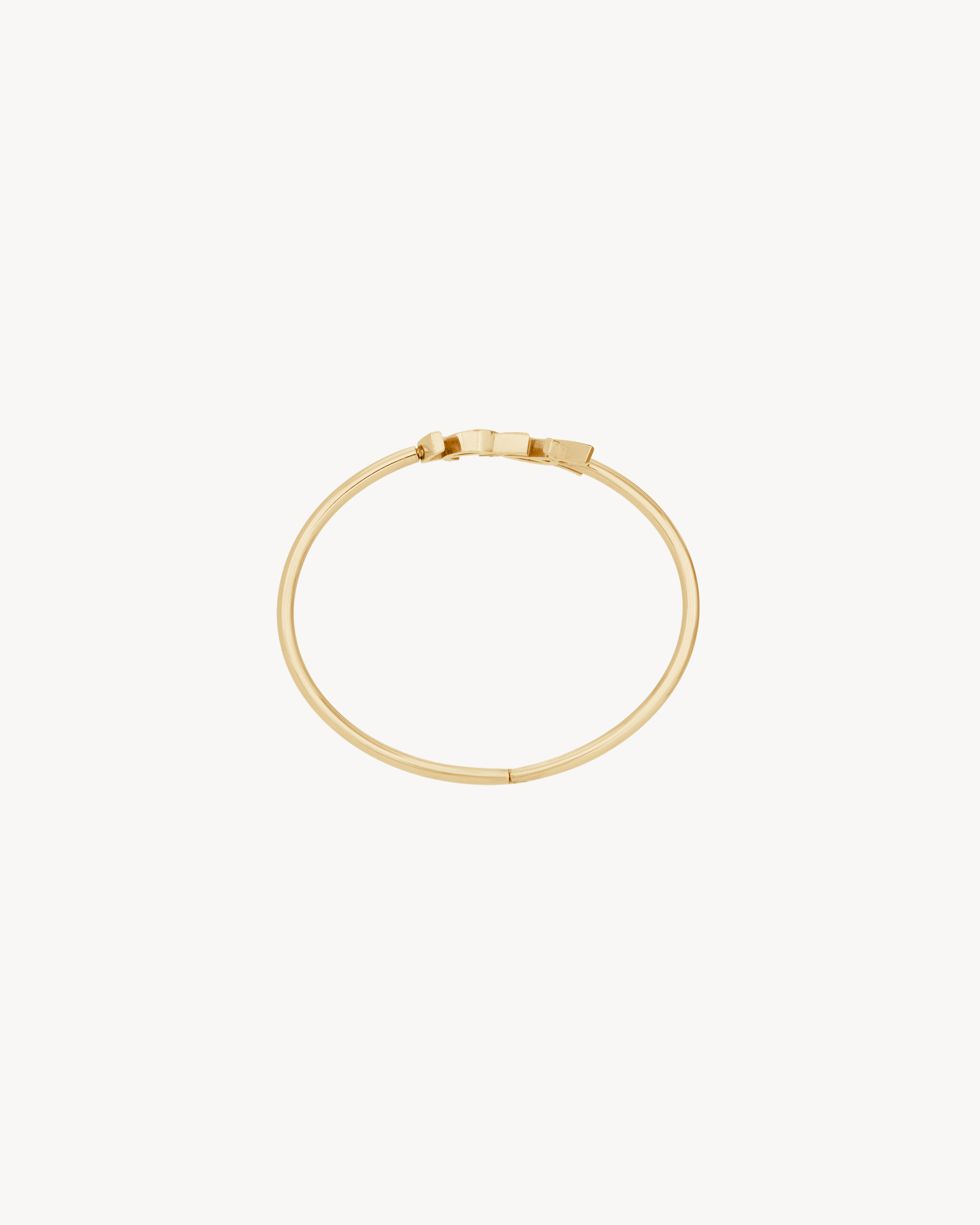 CASSANDRE hinged bangle in 18K yellow gold