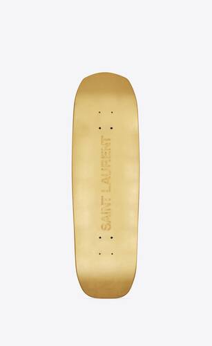 saint laurent skateboard covered with gold leaves