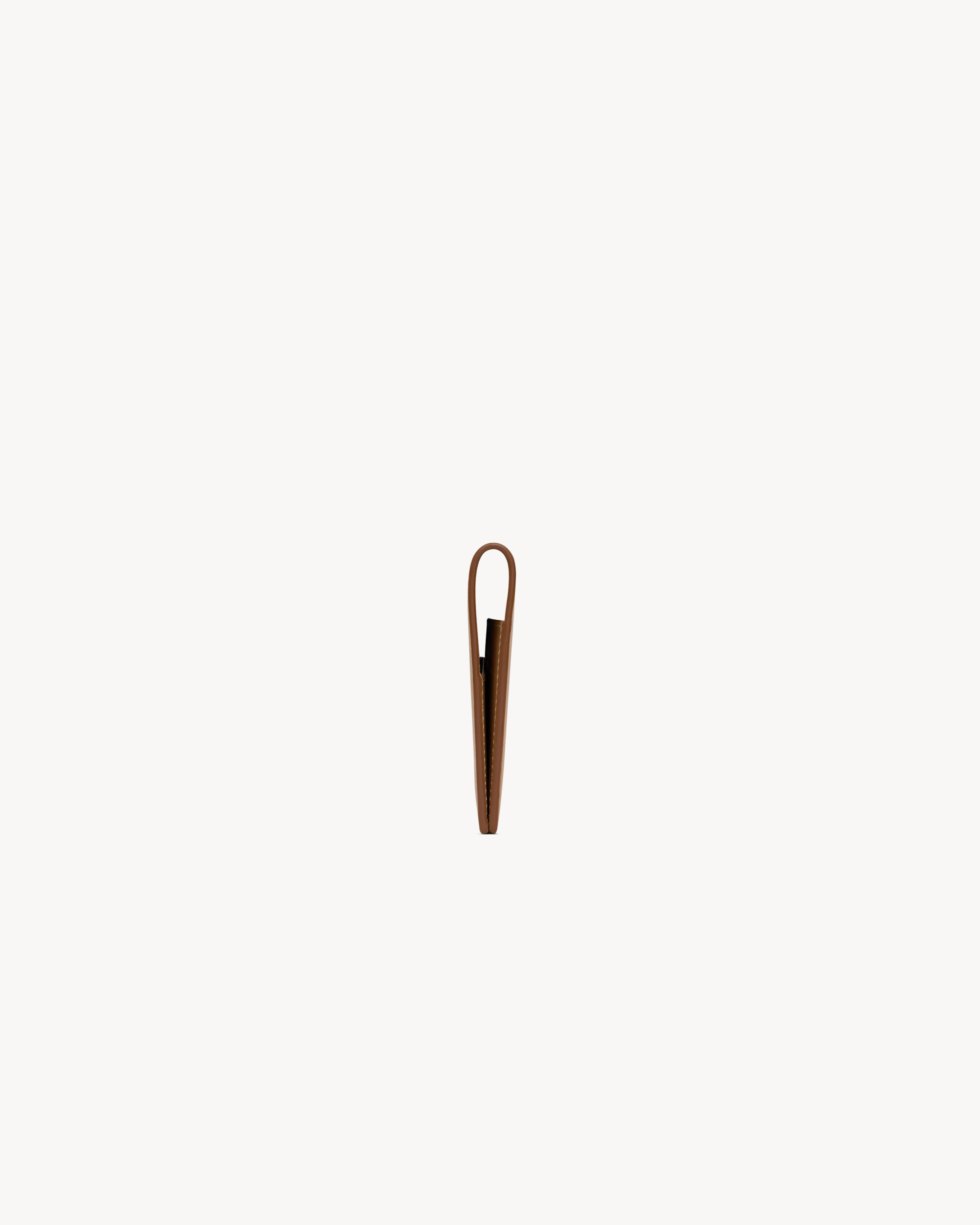 SAINT LAURENT passport case in vegetable-tanned leather