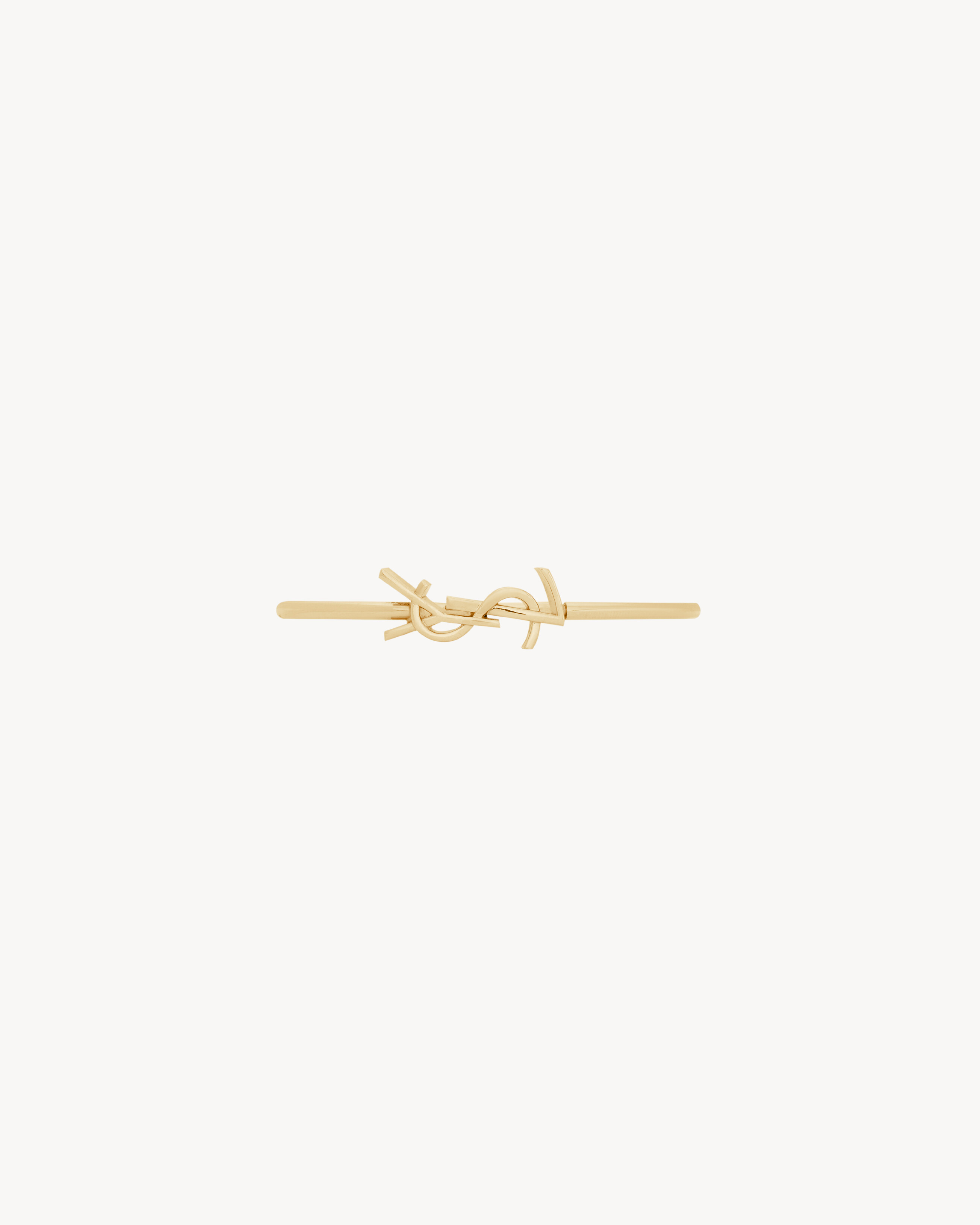 CASSANDRE hinged bangle in 18K yellow gold