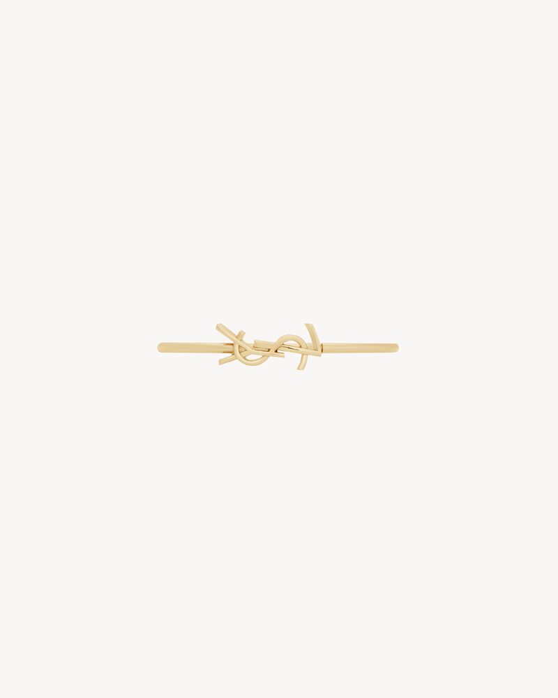 CASSANDRE hinged bangle in 18K yellow gold