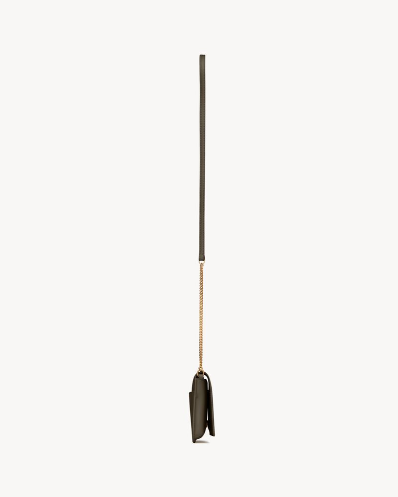 CASSANDRE phone holder in smooth leather in Green | Saint Laurent
