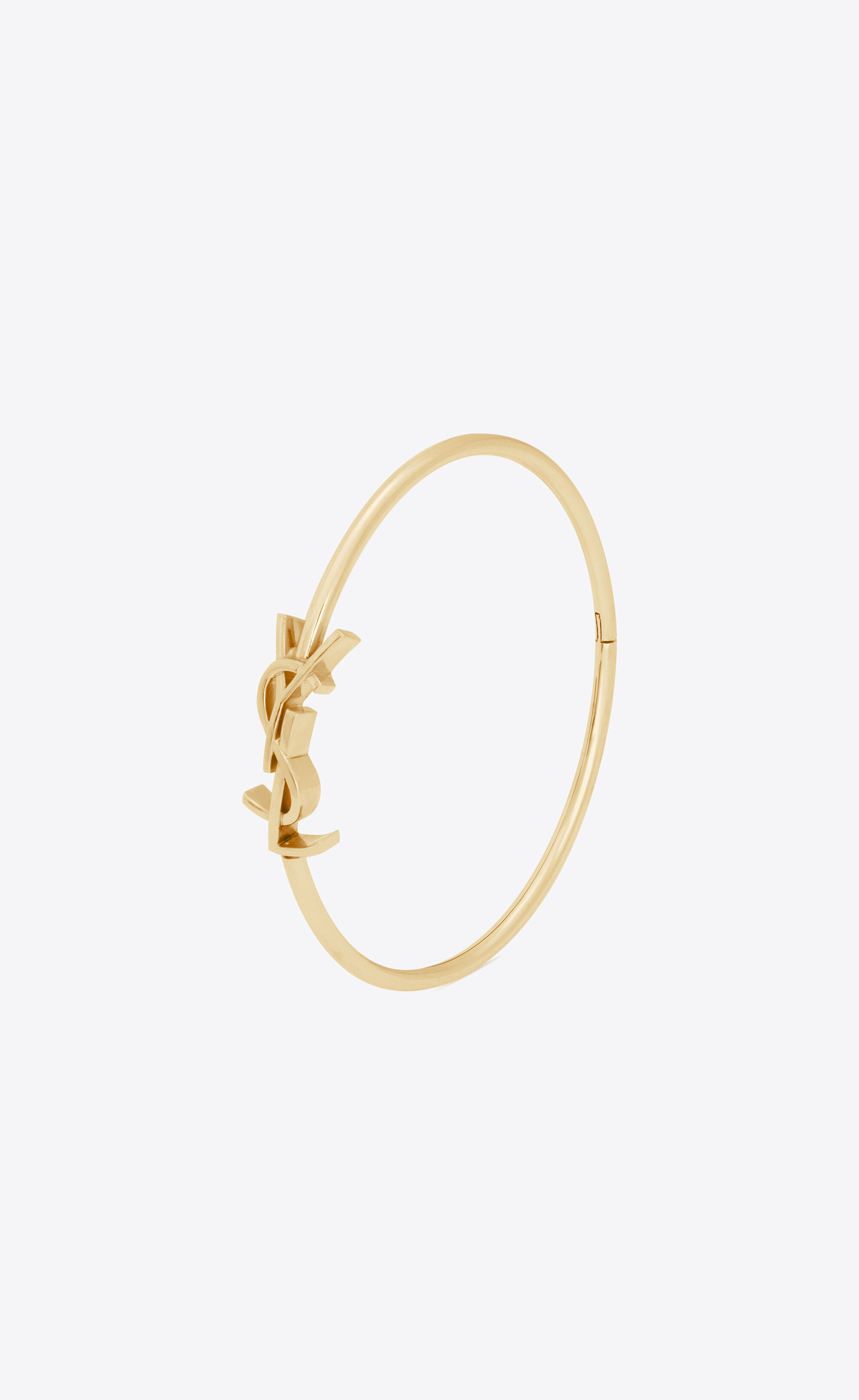 CASSANDRE hinged bangle in 18K yellow gold