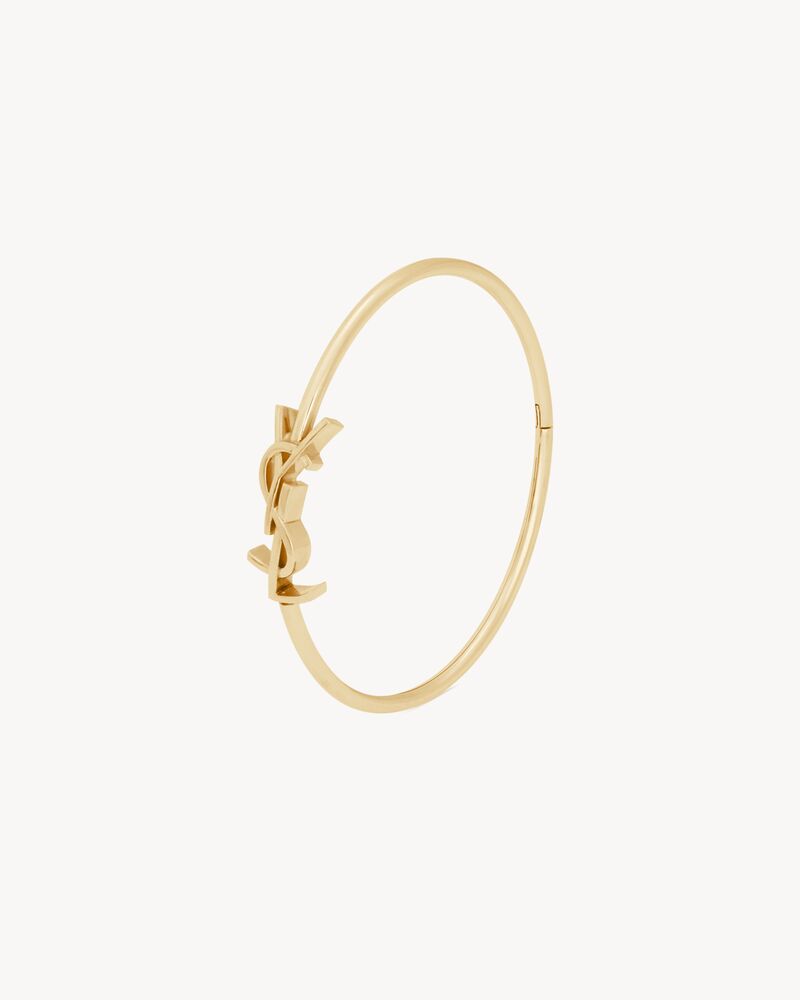 CASSANDRE hinged bangle in 18K yellow gold