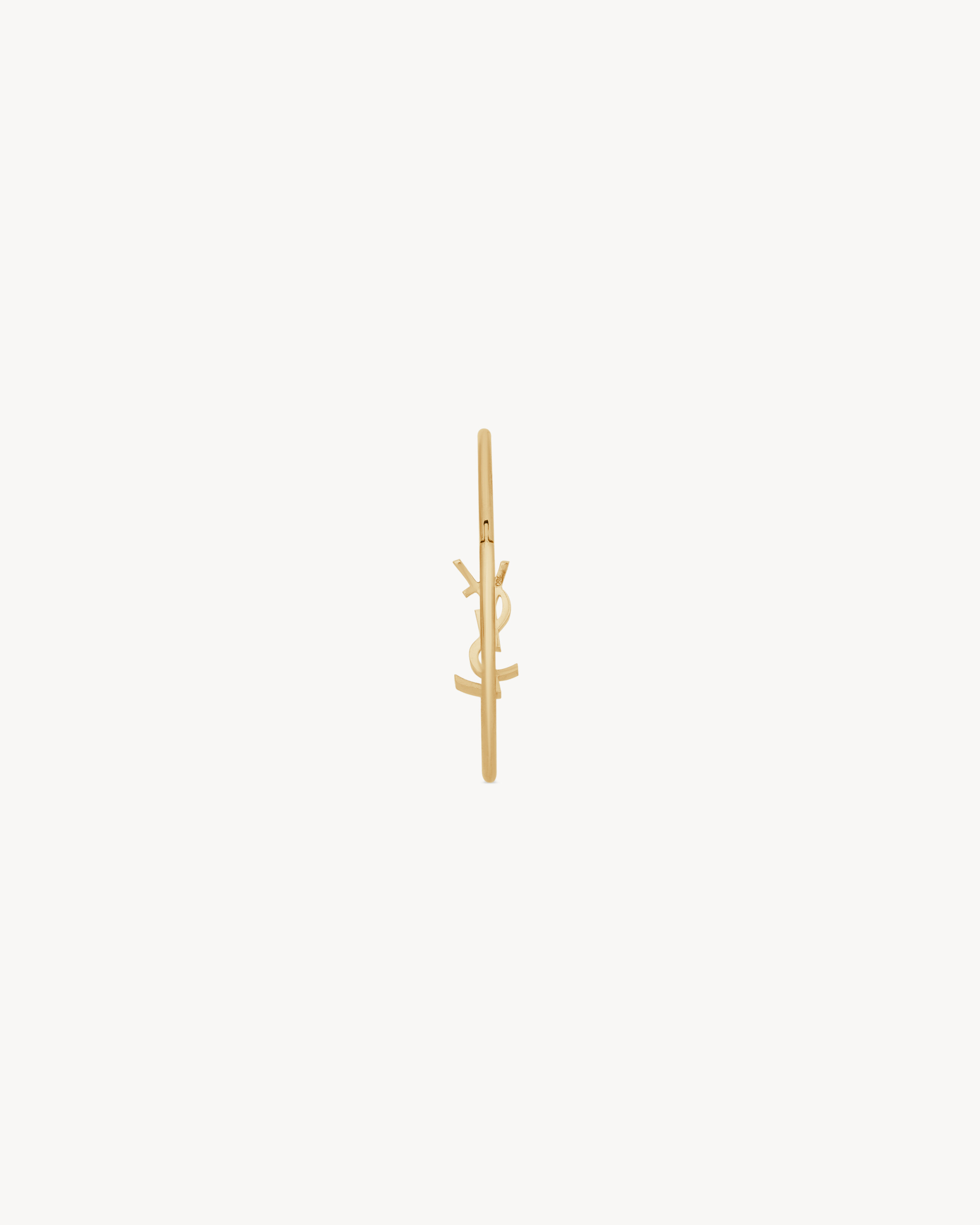 CASSANDRE hinged bangle in 18K yellow gold