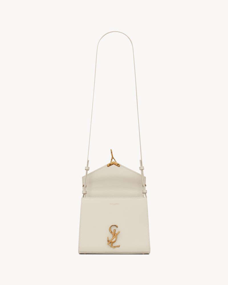CASSANDRA Mini top handle bag in grain de poudre embossed