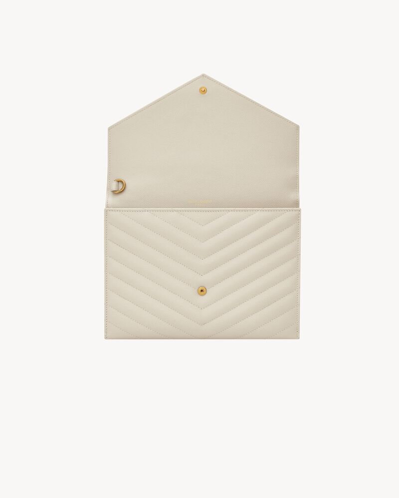 CASSANDRE MATELASSÉ FLAP POUCH in grain de poudre leather