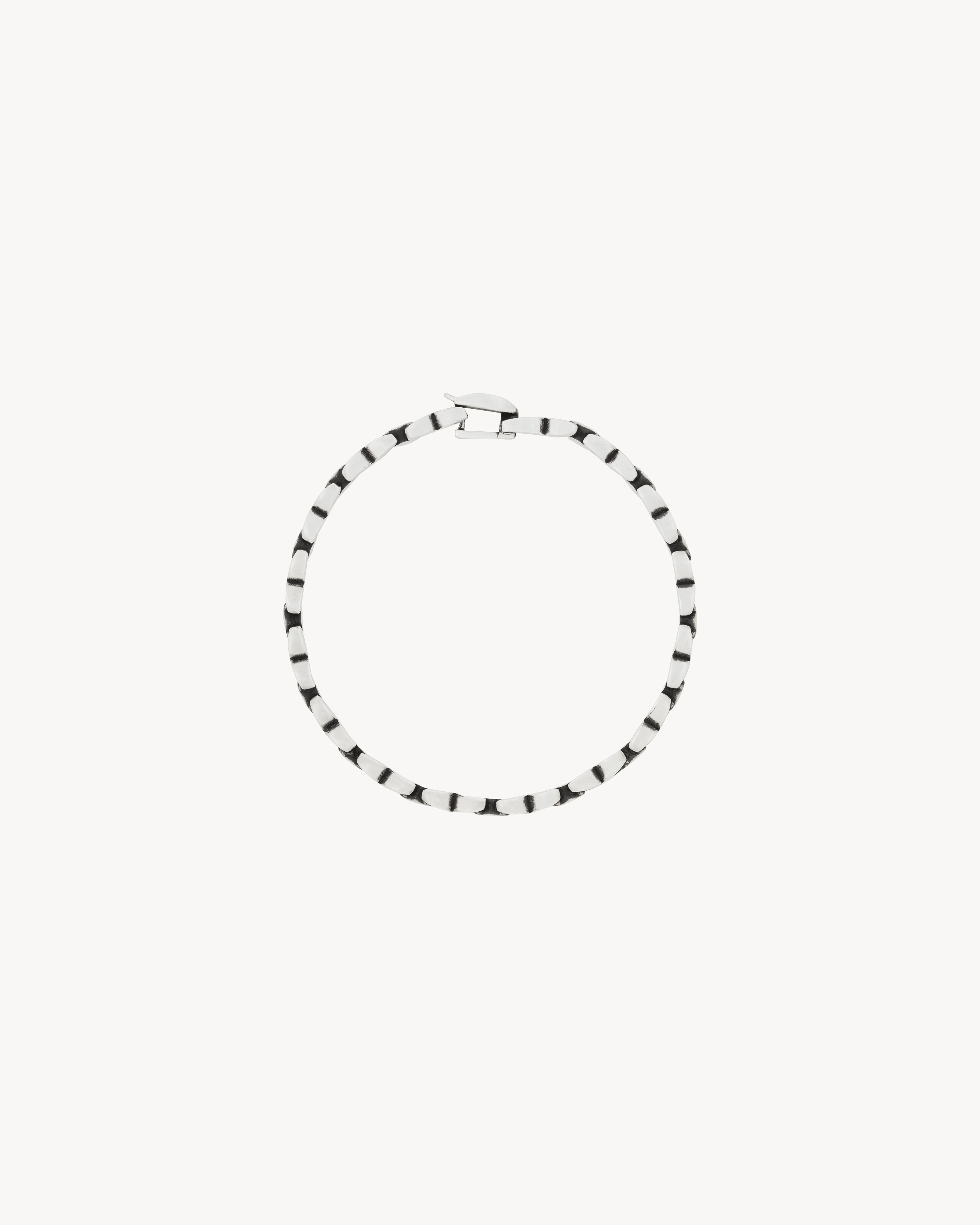 INEINANDERGREIFENDES KETTENARMBAND AUS METALL